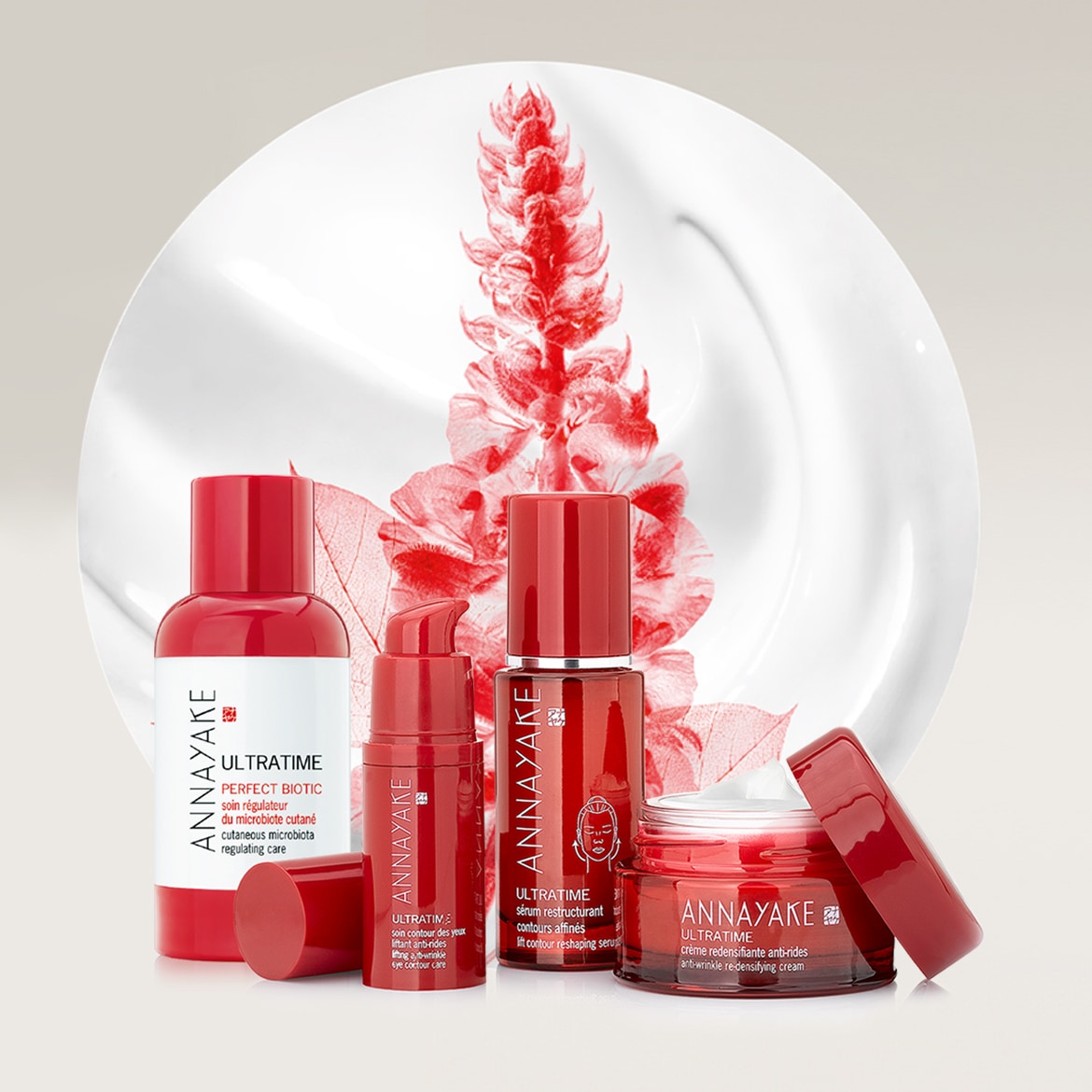 Entdecken Sie die ANNAYAKE ULTRATIME-Kollektion: Perfect Biotic Pflege, restrukturierendes Serum, Anti-Falten Creme und Augenpflege in eleganten roten Verpackungen.
