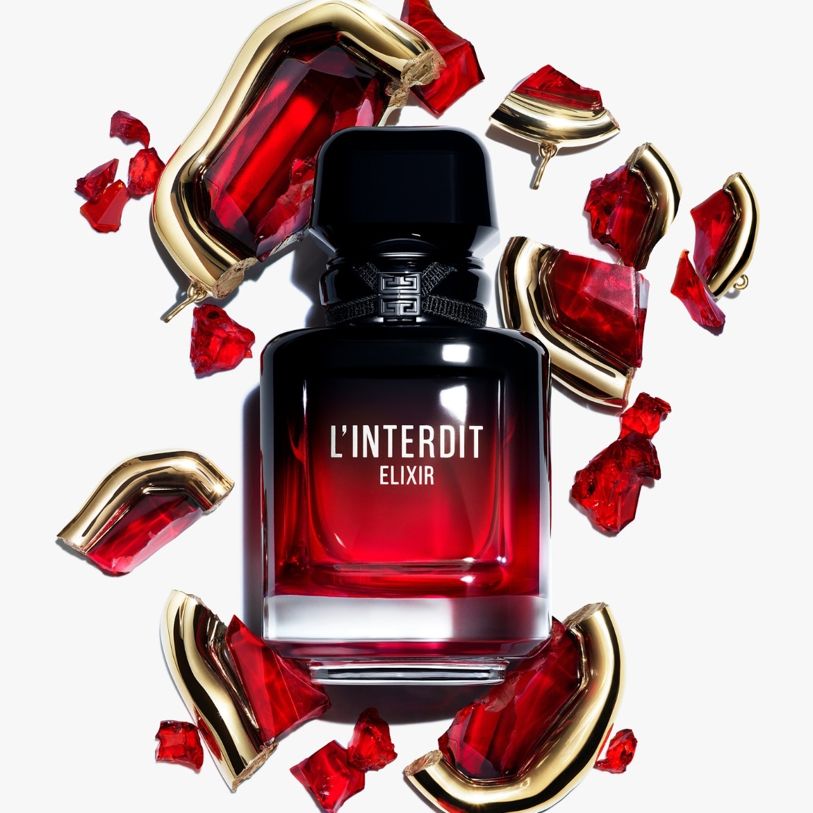 Der L'Interdit Elixir Duft von Givenchy ist in einem eleganten, schwarz-roten Flakon mit goldenen Akzenten und zerbrochenen roten Glasstücken erhältlich.