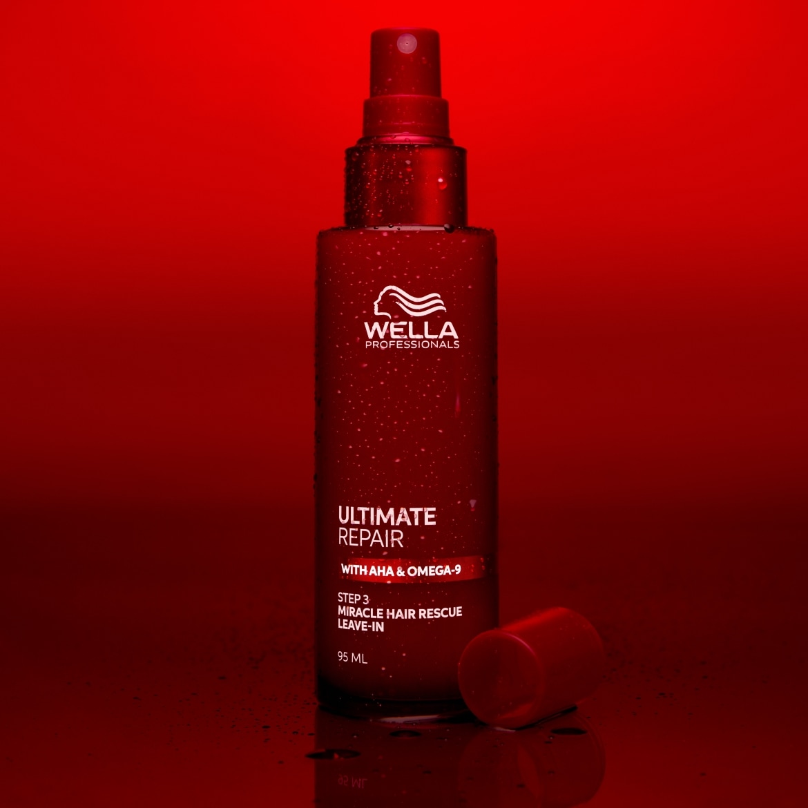 Das Wella Professionals Ultimate Repair Miracle Hair Rescue Leave-In ist eine rote Sprühflasche mit weißer Schrift, die 95 ml des Produkts enthält und für die Haarreparatur entwickelt wurde.