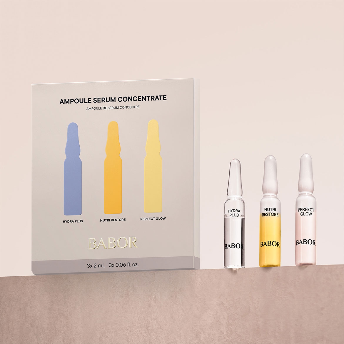 BABOR Ampullen Serum Konzentrat mit Hydra Plus, Nutri Restore und Perfect Glow in einer weißen Verpackung mit drei Ampullen daneben.