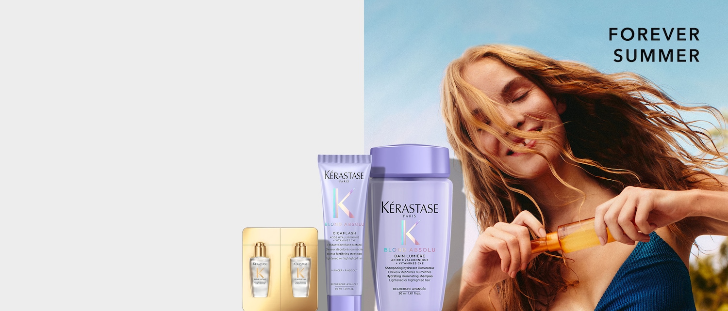 Eine Frau mit blonden Haaren hält eine orangefarbene Flasche in der Hand, während im Hintergrund die Kérastase Blond Absolu Produkte zu sehen sind, darunter ein lila Shampoo und eine Spülung, sowie zwei goldene Flaschen Elixir Ultime.